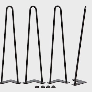 May include: Four black hairpin table legs with a curved top and a mounting plate. The legs are made of metal and are designed for furniture construction. Includes small black protective feet.