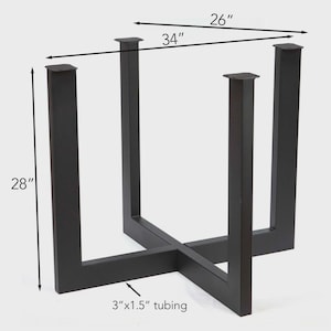 May include: Black metal table base with a cross-shaped design. The base is 28 inches tall, 34 inches wide, and 26 inches deep. The tubing is 3 inches by 1.5 inches. This table base is suitable for various table top styles.