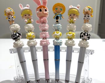 Bolígrafos con personajes hechos a mano con cuentas