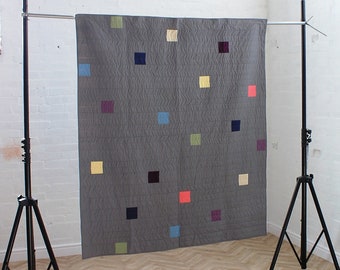 Modern patchwork quilt, grey minimalist quilt, grey modern quilt, grey unisex quilt, colour blocking quilt, Coralie Green UK quilt designer