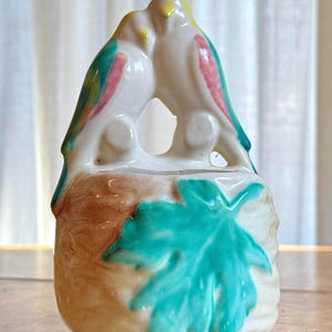 May include: A rustic wooden sign with the text "Welcome to our home" in a handwritten style. The sign features a distressed finish and a simple, inviting design, perfect for a front porch or entryway.