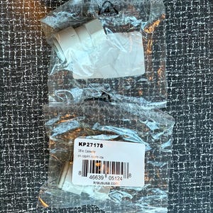 May include: A clear plastic bag contains a white connector. The bag also holds a label with the text "KP27178" and "3/8 in. Connector". The label includes a barcode and the website "kraususa.com".