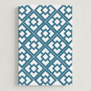 May include: A rectangular canvas print featuring a repeating geometric pattern. The design consists of white shapes set against a teal background. The pattern is a series of interlocking squares and diamonds, creating a visually appealing design.