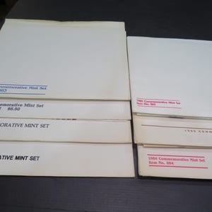 7 US Commemorative Mint Stamp Sets 1980 Thru 1986 15, 18, 20 & 22 Cent Stamps