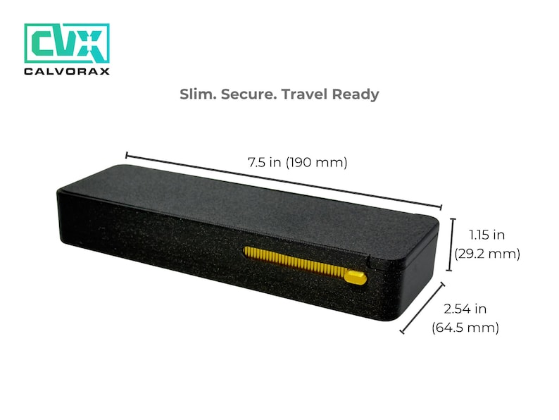 May include: Black rectangular case with a textured surface, featuring a yellow slider. The case is 7.5 inches long, 1.15 inches high, and 2.54 inches wide. The text "Slim. Secure. Travel Ready" is displayed.
