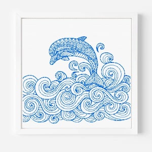 May include: A framed blue and white artwork featuring a leaping dolphin. The dolphin is intricately detailed with patterns, emerging from stylized ocean waves. The artwork is set against a white background within a white frame, creating a clean, nautical aesthetic.