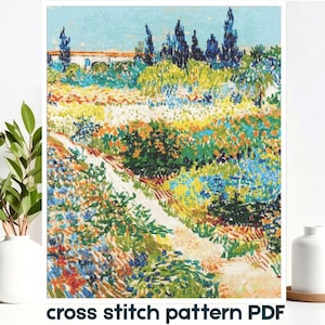 May include: A cross stitch pattern PDF featuring a vibrant landscape with a winding path through a field of colorful flowers, green bushes, and tall dark trees under a light blue sky, with a building visible in the background.