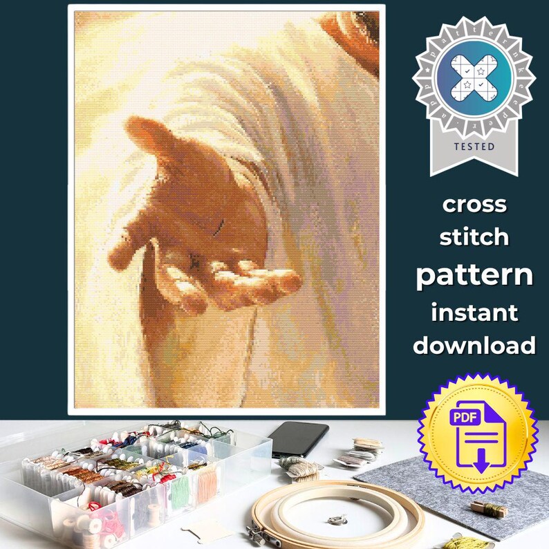 May include: A cross stitch pattern instant download featuring a digital illustration of an outstretched hand in warm golden tones. The image includes a blue and white tested badge and the text cross stitch pattern instant download.