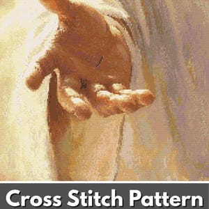May include: A cross stitch pattern featuring a digital illustration of an outstretched hand with a bright, glowing background. The lower section displays a grid with various symbols and a green circular badge containing the text PDF.