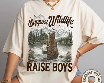 Camiseta para niños "Apoya la vida silvestre, cría" con colores cómodos y un toque de humor sobre la naturaleza y el aire libre.