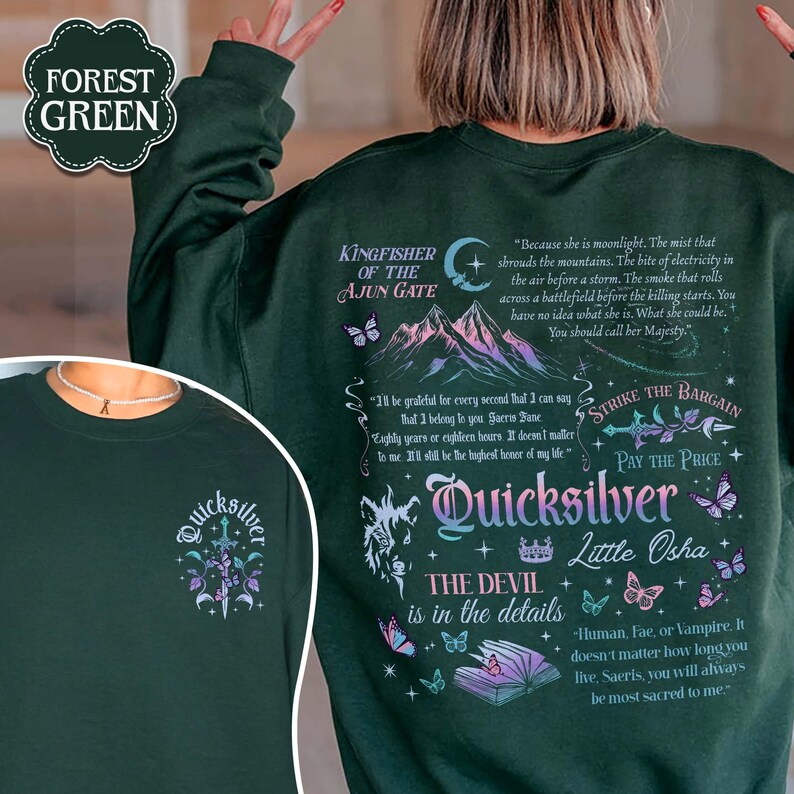 May include: Dark green sweatshirt with the word "Quicksilver" and other text and graphics. The back of the sweatshirt features text including "Kingfisher of the Ajun Gate" and "Strike the Bargain". The front has a smaller design.