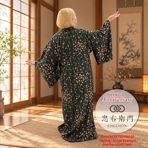 May include: A dark green floor-length kimono featuring a repeating pattern of small pink and white cherry blossoms with long wide sleeves. A circular graphic overlay displays the text 100th Anniversary, a logo, and the name CHUEMON.