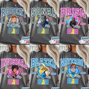 May include: Six dark gray t-shirts with different character names in a collegiate style font. Each shirt has a unique character graphic, the text "EST. 2025", and the word "DISPATCH". The shirts are a casual style.