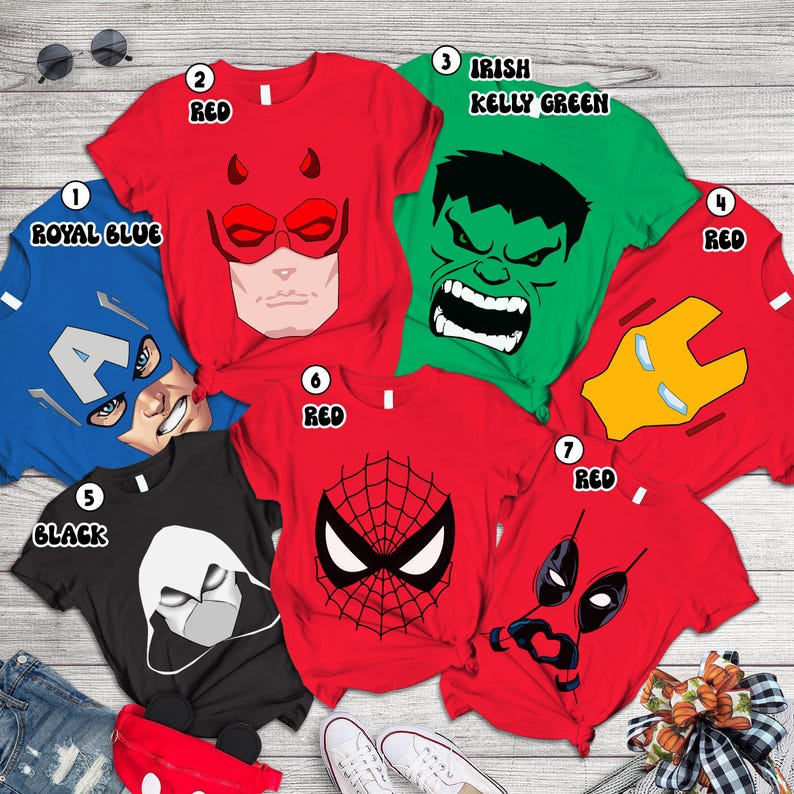 A collection of superhero-themed t-shirts, each with a different character design, including the Hulk, Captain America, Spider-Man, and Iron Man.