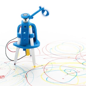 May include: A blue 3D-printed robotic drawing device featuring a central frame that holds three white markers with red, yellow, and blue tips. The robot has a spinning top component and thin black and red wires, creating colorful circular scribbles.