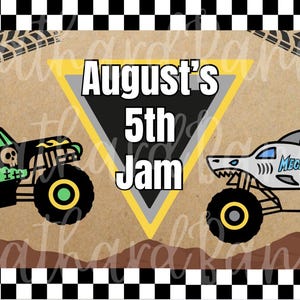 May include: A graphic design featuring two monster trucks, one green and black with a skull, the other white with a shark design. The text "August's 5th Jam" is in a yellow triangle.
