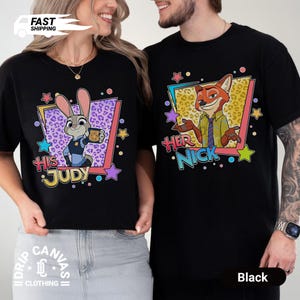May include: Black t-shirts featuring cartoon characters Judy Hopps and Nick Wilde from Zootopia. The Judy shirt has the text "HIS JUDY" and the Nick shirt has the text "HER NICK". Both shirts have colorful star and geometric designs.