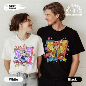 May include: White and black t-shirts with cartoon graphics. The white shirt features a bunny character with the text "His Judy". The black shirt has a fox character with the text "Her Nick". Both shirts have colorful star and geometric designs.