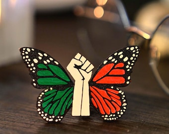 Anti ICE protest pin. Abolish ICE for Immigrant Rights, Orange Butterfly for Activists, Solidarity in Social Justice and Political Matters