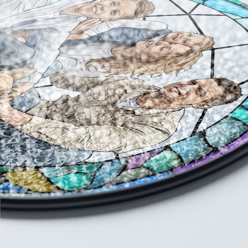 May include: A round, stained-glass art piece featuring a family portrait. The artwork is framed in black and has a mosaic-like border with shades of blue, green, purple, and yellow. The family is depicted in a relaxed pose, with soft, blended colors.