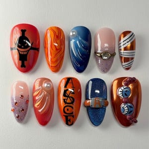 May include: A collection of ten almond-shaped acrylic nails with diverse designs. The nails showcase a spectrum of colours, including red, orange, blue, and pink, with embellishments such as pearls, rings, and graphic art. Some nails feature intricate patterns and character-inspired art.