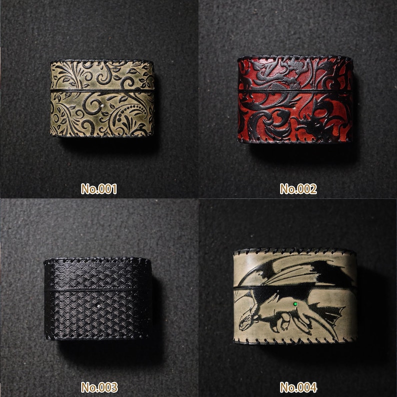 May include: Four small, rectangular leather boxes with decorative designs. The boxes are in various colours, including olive green, red, black, and tan. Each box has a different embossed pattern or image, such as floral, dragon, or geometric.