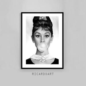 May include: Black and white framed print of a woman with a bubble of gum in her mouth, wearing a pearl necklace and earrings. Her hair is styled in a classic updo. The print is signed "RICARDOART" at the bottom.