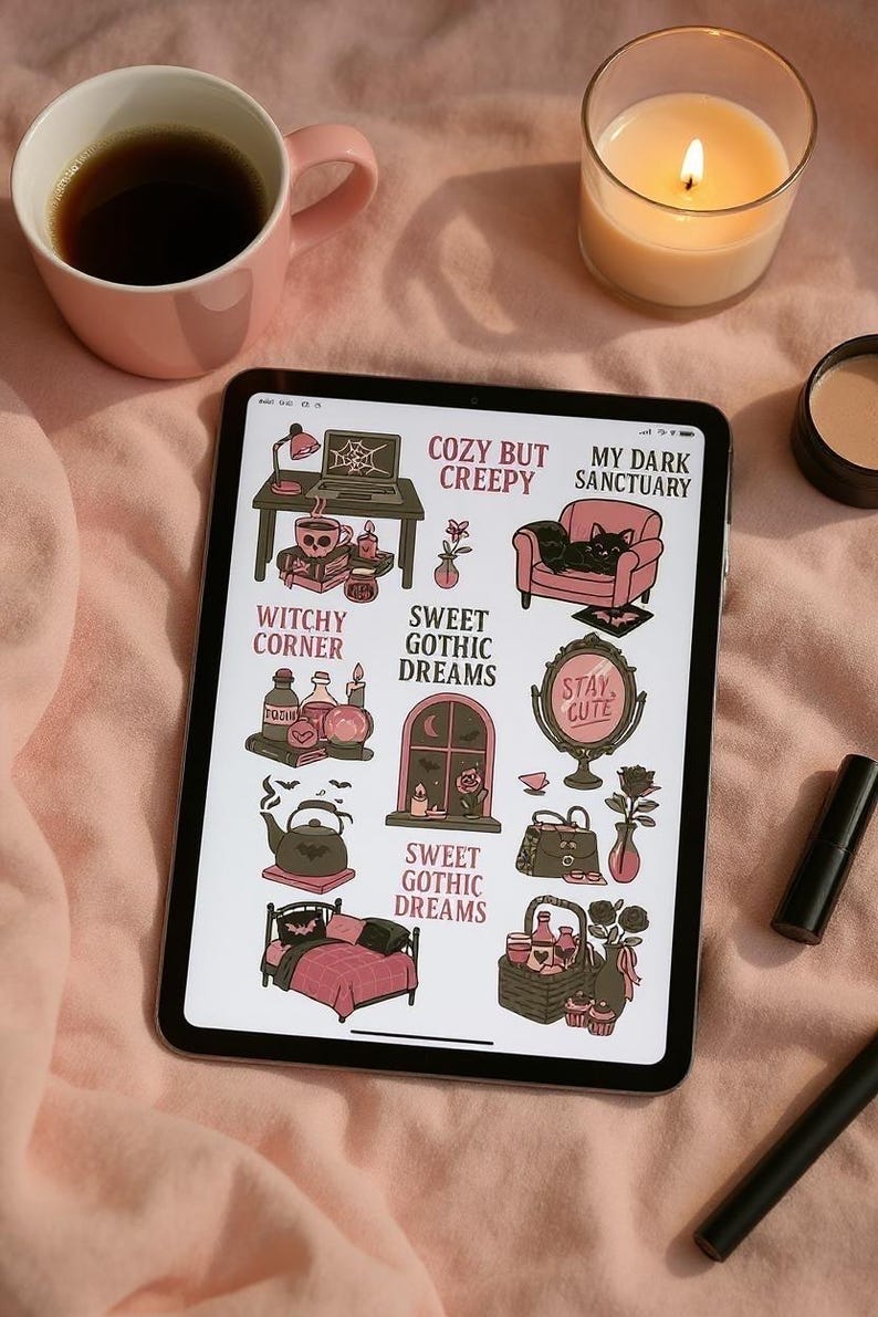 May include: A digital tablet displaying gothic-themed illustrations with text like "Cozy But Creepy" and "Sweet Gothic Dreams." The image includes a pink mug with coffee, a lit candle, and makeup. The overall theme is a cozy, witchy aesthetic.