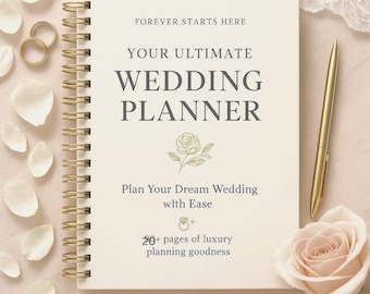 May include: A cream-colored wedding planner with gold spiral binding, a gold pen, and a rose. The cover reads "YOUR ULTIMATE WEDDING PLANNER" with the text "FOREVER STARTS HERE" above and "Plan Your Dream Wedding with Ease" below. Gold wedding rings and petals are scattered around.