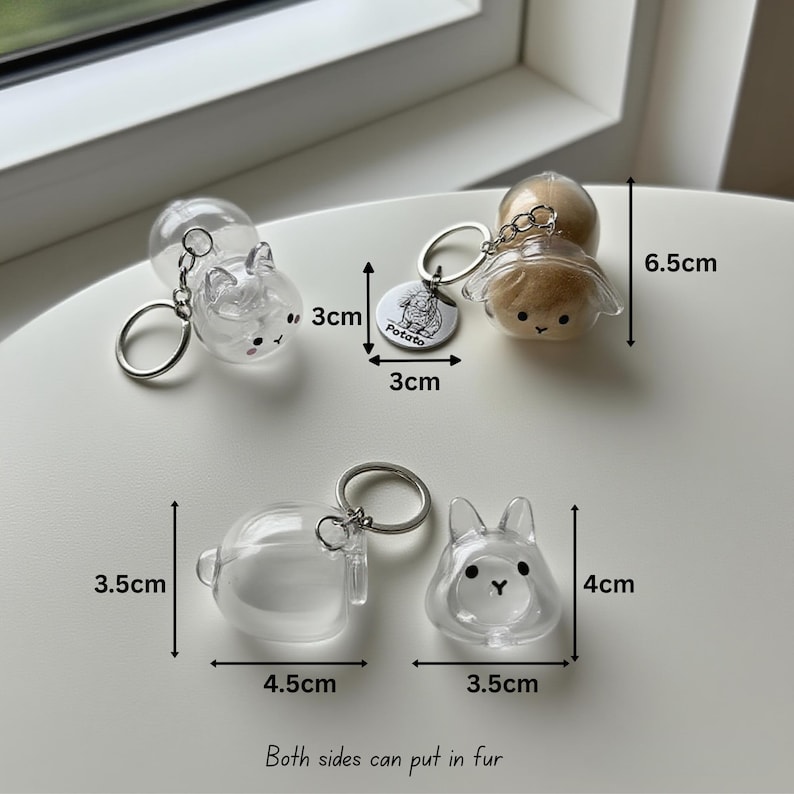 May include: Clear plastic keychains in the shape of animals, including a bunny and a dog, with silver key rings. The keychains are 3 cm to 6.5 cm in height. One keychain has a tag that says "Potato". The text "Both sides can put in fur" is also visible.