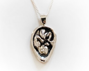 Baby in Utero necklace in sterling silver. Detailed and beautiful