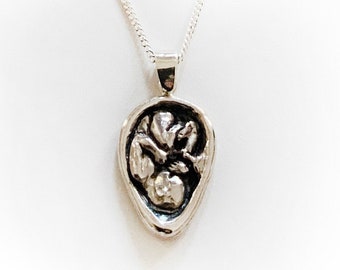 Baby in Utero necklace in sterling silver. Detailed and beautiful