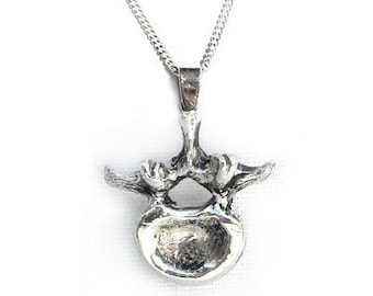 Vertebra necklace in sterling silver with intricate anatomical detail by medical artist Beth Croce