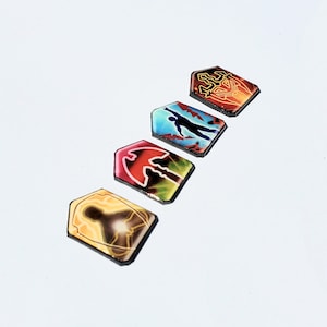 May include: Five colorful, rectangular game pieces with different designs. Each piece features a unique graphic, including a person, a bird, a symbol, and a silhouette.