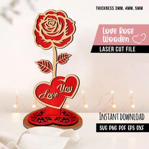May include: A wooden laser-cut rose with a red flower and two red hearts that read "Love You". The design includes a base and leaves. The text "Love Rose Wooden" and "Laser Cut File" are also visible.