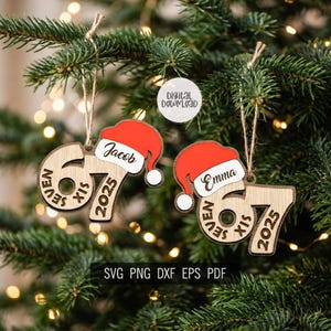 May include: Two wooden Christmas ornaments hanging on a tree. Each ornament is shaped like the number 67 with the text "SEVEN SIX" and "2025". A red Santa hat with a white pom-pom and a name is on top. The text "SVG PNG DXF EPS PDF" is at the bottom.