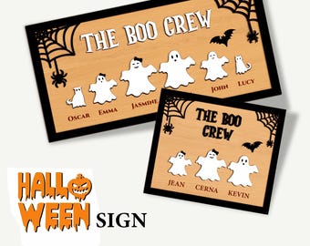 May include: Wooden Halloween sign with the text "THE BOO CREW" and ghost figures. The sign also features spiderwebs, bats, and the names of family members. The words "HALLOWEEN SIGN" are also visible.