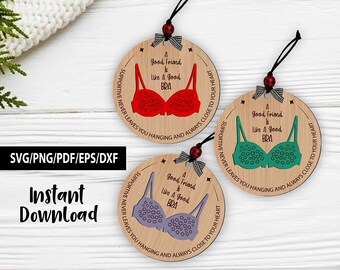 May include: Three wooden ornaments with a bra design in red, green, and purple. Each ornament has a black string, a bow, and the text "A good friend is like a good bra." The words "Supportive never leaves you hanging and always close to your heart" are also on the ornaments.