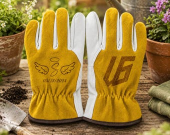 May include: A pair of yellow and white leather gardening gloves. The left glove features a stylized letter S with angel wings and the date 05/27/2024. The right glove displays a large, bold, geometric monogram logo consisting of the letters U and G.