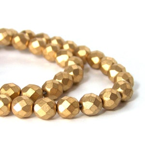 Metallic gold glass beads, matte finish 8mm faceted round  (668G)
