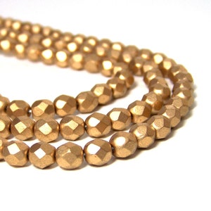 6mm Metallic gold glass beads, matte finish, faceted round 695G image 2
