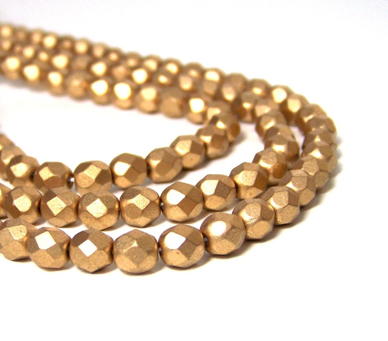 6mm Metallic gold glass beads, matte finish, faceted round 695G image 2