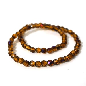 Faceted glass beads, 6mm amber yellow with blue iris finish, Czech Fire Polished Glass 836F image 2