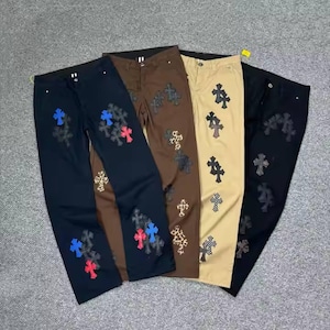 Calças com bordados cruzados – Calças multicoloridas de streetwear para homens e mulheres