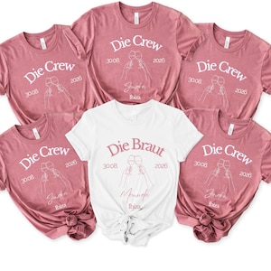 May include: Five short-sleeved t-shirts in mauve and white. Four mauve shirts feature the text Die Crew, 30.08, 2026, Ibiza, and a line art graphic of two clinking wine glasses. One white shirt features the text Die Braut, 30.08, 2026, Ibiza, and wine glasses.