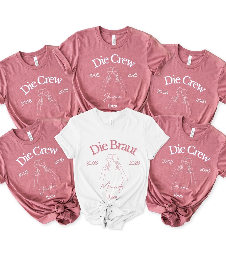 May include: Five short-sleeved t-shirts in mauve and white. Four mauve shirts feature the text Die Crew, 30.08, 2026, Ibiza, and a line art graphic of two clinking wine glasses. One white shirt features the text Die Braut, 30.08, 2026, Ibiza, and wine glasses.