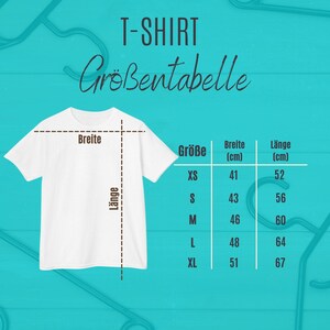 May include: White t-shirt with a size chart in German. The chart shows measurements for XS, S, M, L, and XL sizes. The width measurements range from 41 cm to 51 cm, and the length measurements range from 52 cm to 67 cm.