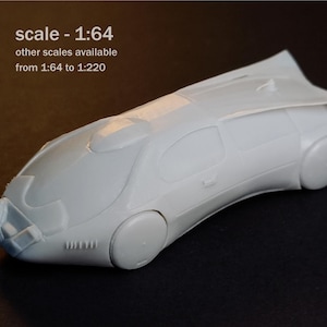 May include: A light grey unpainted model car with a futuristic aerodynamic design, featuring smooth body panels, rounded wheel covers, and a rear spoiler. The text on the image reads M scale - 1:64 other scales available from 1:64 to 1:220.