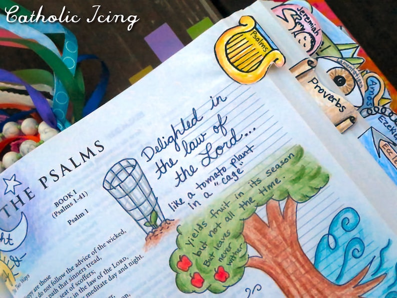 May include: A close-up of a page from a Bible with hand-drawn illustrations. The page is open to the book of Psalms and features a colorful drawing of a tomato plant with the text "Delighted in the law of the Lord... like a tomato plant in a "cage"... yields fruit in its season but not all the time. But leaves never wither."