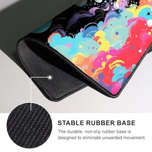 May include: A rectangular mousepad with a colorful, abstract design featuring vibrant hues of pink, yellow, blue, and purple against a black background. The mousepad has a black, non-slip rubber base. Text on the image reads: STABLE RUBBER BASE.